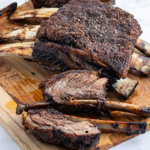 Juicy smoked wagyu ribs on a cutting board